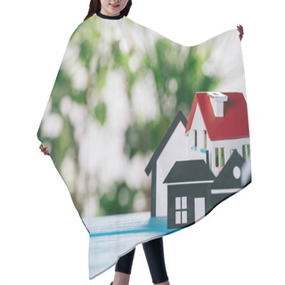 Personality  Selective Focus Of Paper Houses And House Model On Wooden Desk, Mortgage Concept Hair Cutting Cape