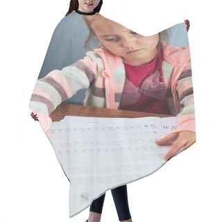 Personality  Little Girl Preschooler Learning To Write Letters Reluctantly. Kid Writing Letters, Doing A School Work Unwillingly. Concept Of Early Education Hair Cutting Cape
