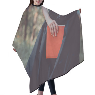 Personality  Cropped View Of Adult Woman In Witch Costume Standing With Red Book Hair Cutting Cape