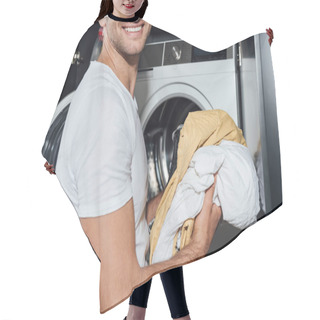 Personality  Cropped View Of Happy Man Holding Dirty Laundry Near Washing Machine  Hair Cutting Cape
