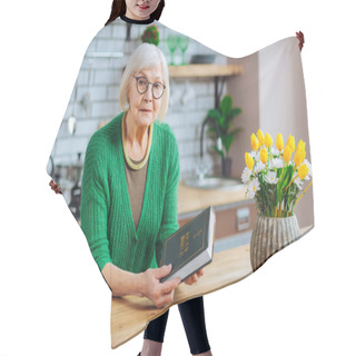 Personality  Beautiful Grey-haired Woman Holding A Holy Bible Book At Kitchen Hair Cutting Cape