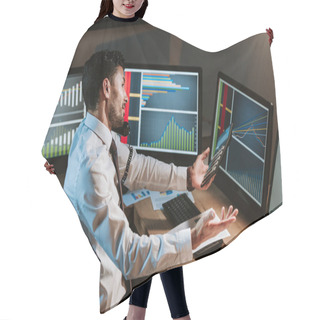 Personality  High Angle View Of Bi-racial Trader Talking On Telephone And Looking At Computer With Graphs  Hair Cutting Cape