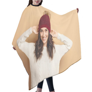 Personality  Girl In Knitted Sweater And Beanie Hat Over Beige Background Hair Cutting Cape