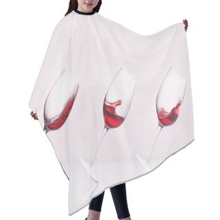 Personality  Row Of Inclined Wineglasses With Splashing Wine On Reflective Surface And On White Hair Cutting Cape