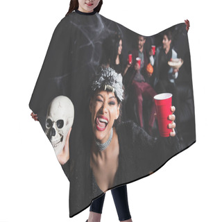 Personality  African American Woman In Wolf Halloween Mask Sticking Out Tongue While Holding Spooky Skull And Plastic Cup On Black  Hair Cutting Cape