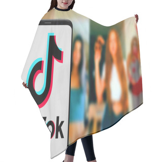 Personality  Smart Phone With TIK TOK Logo, Which Is A Popular Social Network On The Internet.United States, Wednesday, November 27, 2020 Hair Cutting Cape