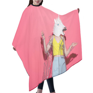 Personality  Funny Woman In Fashionable Transparent Raincoat And Unicorn Mask On Red Hair Cutting Cape