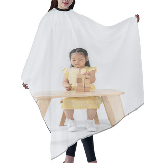 Personality  Asian Preschooler Girl In Yellow Dress Playing With Wooden Shapes On Grey Hair Cutting Cape