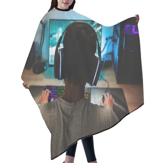 Personality  Back View Of Teenage Gamer Boy Playing Video Games Online On Computer In Dark Room Wearing Headphones With Microphone And Using Backlit Colorful Keyboard Hair Cutting Cape