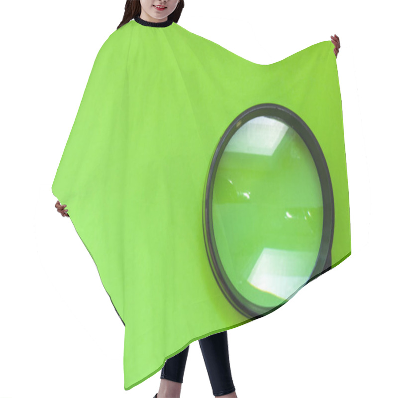 Personality  Black Magnifying Glass For Reading Or As A Tool Of Investigation Is On A Green Background With A Clean Half Photo Region For Labels Or Headers. Illustrative Photo For Green Designs Hair Cutting Cape