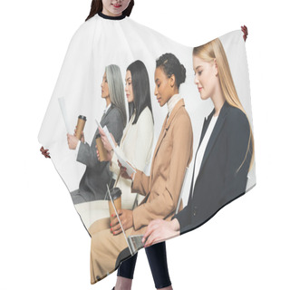 Personality  Side View Of Multicultural Businesswomen Sitting On Chairs With Paper Cups And Laptop On White  Hair Cutting Cape