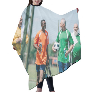 Personality  Group Of Interracial Elderly Sportsmen With Sportive Water Bottles Walking On Football Field Hair Cutting Cape