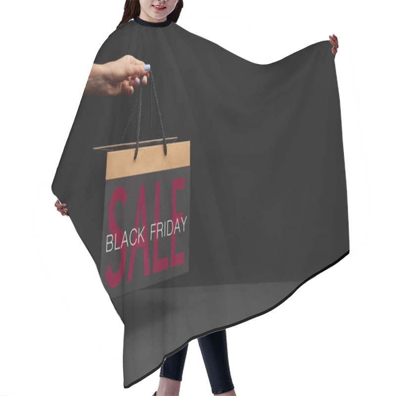Personality  partial view of woman holding black shopping bag with black friday sale hair cutting cape