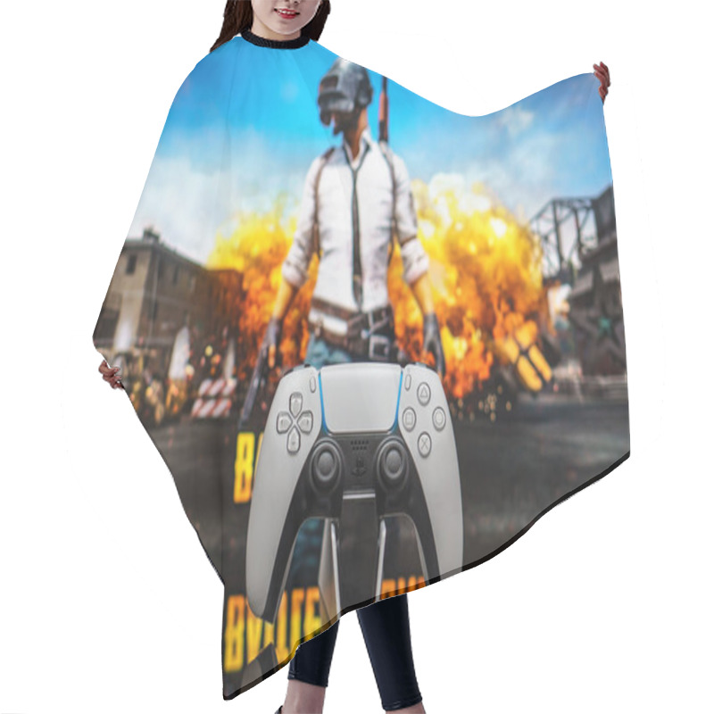 Personality  December 20, 2020, Odessa, Ukraine. White New Playstation 5 Gamepad On The Background Of The Game PUBG. PLAYERUNKNOWN'S BATTLEGROUNDS Cybersport Poster Concept. Hair Cutting Cape