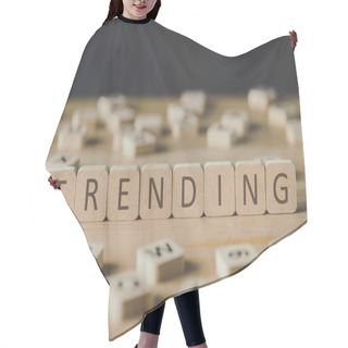 Personality  Selective Focus Of Word Trending Made Of Cubes Surrounded By Blocks With Letters On Wooden Surface Isolated On Black Hair Cutting Cape