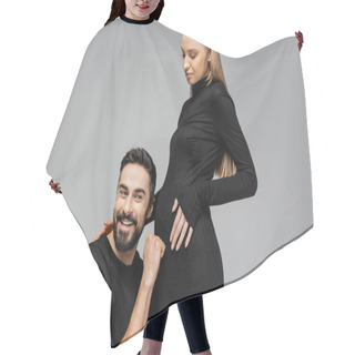 Personality  Cheerful Bearded Man In T-shirt Knocking On Belly Of Fashionable And Pregnant Wife In Black Dress And Standing Together Isolated On Grey, Growing New Life Concept, Funny, Father To Be Hair Cutting Cape