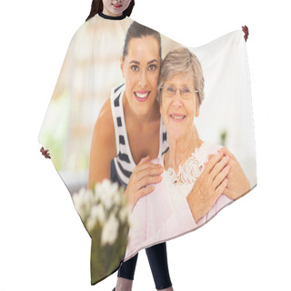 Personality  Pretty Woman And Senior Mother At Home Hair Cutting Cape