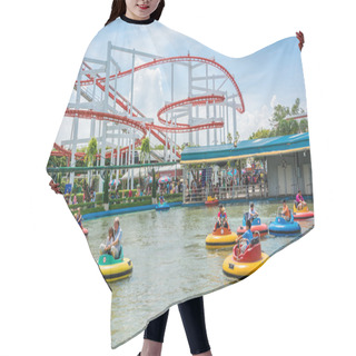 Personality  People With Various Age Plays Lifebuoy-shape Boat With Roller Coaster Background In The Amusement Park Hair Cutting Cape