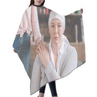 Personality  Cropped Shot Of Woman Supporting Sick Mature Mother In Kerchief Looking At Camera Hair Cutting Cape