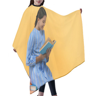 Personality  Happy Schoolgirl In Blue Dress Reading Book While Sitting On Yellow Hair Cutting Cape