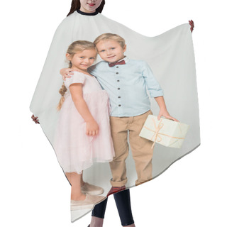Personality  Cute Boy Holding Gift Box And Embracing Adorable Sister On Grey Background Hair Cutting Cape