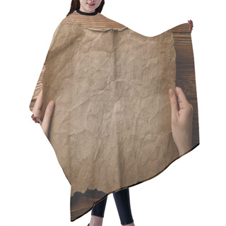 Personality  Cropped View Of Man Holding Old Parchment Sheet In Hands  Hair Cutting Cape