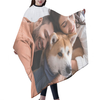 Personality  Happy Young Couple Hugging Akita Inu Dog At Home Hair Cutting Cape