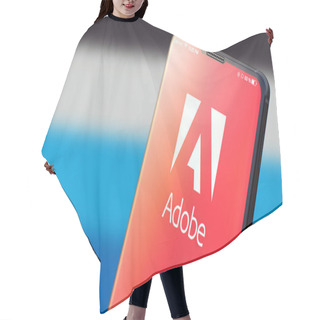 Personality  KYIV, UKRAINE-JUNE, 2020: Adobe On Smart Phone Screen. Hair Cutting Cape