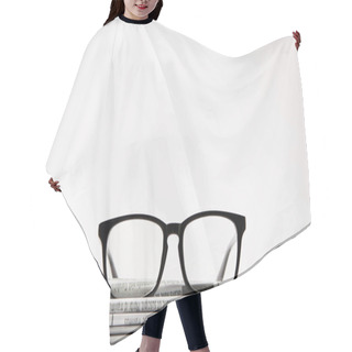 Personality  Close Up Of Eyewear On Pile Of Newspapers, Isolated On White Background With Copy Space Hair Cutting Cape