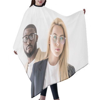 Personality  Portrait Of Beautiful Stylish Young Multiethnic Couple In Spectacles Looking At Camera Isolated On Grey Hair Cutting Cape