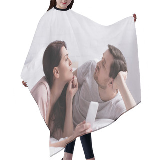 Personality  Woman With Smartphone Pouting Lips Near Husband On Bed  Hair Cutting Cape
