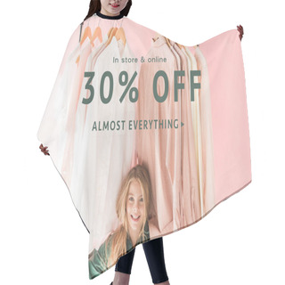 Personality  Cheerful Charming Kid In Trendy Overalls Sitting Under Clothes On Hangers, Store Sale Banner Concept Hair Cutting Cape