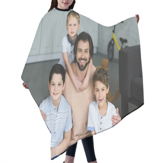 Personality  Portrait Of Happy Father Hugging Little Sons And Looking At Camera At Home Hair Cutting Cape