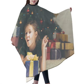 Personality  Amused Child Pointing With Finger At Gift Boxes While Lying On Floor Near Christmas Tree Hair Cutting Cape
