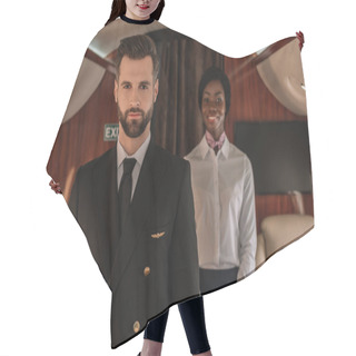 Personality  Selective Focus Of Confident Pilot And Smiling African American Stewardess Looking At Camera In Private Plane Hair Cutting Cape