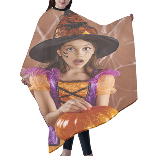 Personality  Amazed Girl In Witch Hat And Halloween Costume Standing With Pumpkin On Brown Backdrop, Cobwebs Hair Cutting Cape