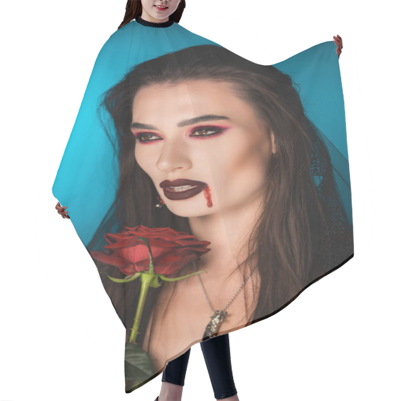 Personality  creepy woman with blood on face near red rose on blue hair cutting cape