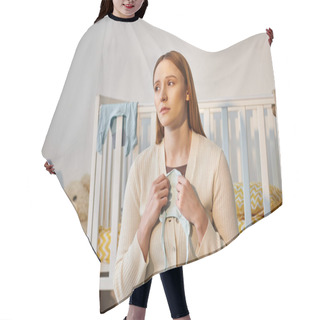 Personality  Young Grieving Woman Holding Baby Clothes And Looking Away Near Crib In Nursery Room At Home Hair Cutting Cape
