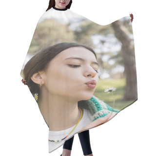 Personality  Portrait Of Young Brunette Woman Blowing On Daisy Flower In Summer Park  Hair Cutting Cape