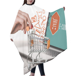 Personality  Cropped View Of Woman Holding Toy Shopping Cart Near Laptop And Illustration On White, E-commerce Concept Hair Cutting Cape