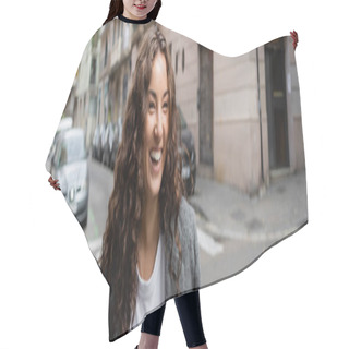 Personality  Cheerful And Curly Young Woman In Casual Clothes And Jacket Looking Away While Standing On Blurred Urban Street With Buildings And Cars At Background In Barcelona, Spain, Banner  Hair Cutting Cape