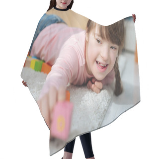 Personality  Child With Down Syndrome Holding Toy Cube Hair Cutting Cape