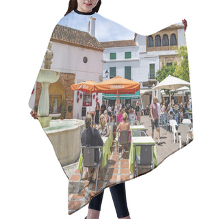 Personality  SPAIN, MARBELLA, 25, MAY, 2023: People Have Lunch In Street Cafe On Orange Square Near The Fountain In Marbella Old Town, Spain. Hair Cutting Cape