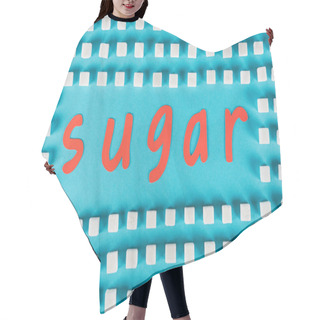 Personality  Top View Of Red Paper Cut Word Sugar Surrounded By White Sugar Cubes On Blue Surface Hair Cutting Cape