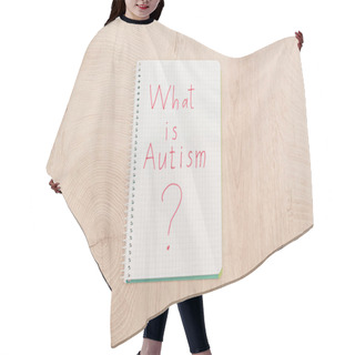 Personality  Top View Of Red What Is Autism Question Written In Notebook On Wooden Table Hair Cutting Cape