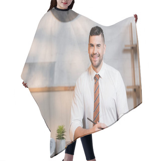 Personality  Smiling Architect Looking At Camera While Sitting At Workplace Near Rolled Blueprints Hair Cutting Cape