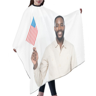 Personality  Cheerful African American Man Smiling At Camera While Holding Small Flag Of Usa Isolated On White Hair Cutting Cape