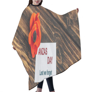 Personality  Panoramic Shot Of Card With Anzas Day Lettering Near Artificial Flower On Wooden Surface  Hair Cutting Cape