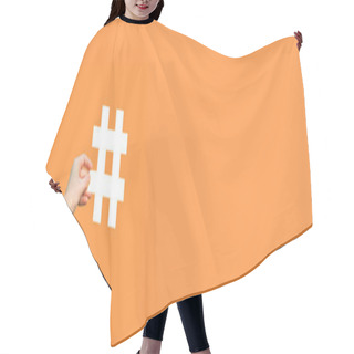 Personality  Cropped View Of Human Hand Showing Large Big White Hashtag Sign On Orange Background, Marketing Symbol And Social Media Concept  Hair Cutting Cape
