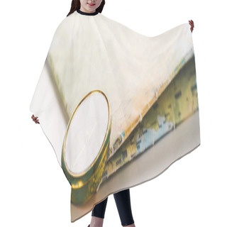 Personality  Panoramic Shot Of Golden Compass Near Map On White  Hair Cutting Cape